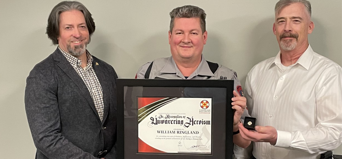 William Ringland holding his Canadian Security Lifesaver Award